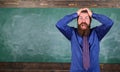 Man bearded teacher or educator hold head chalkboard background. Pay attention to your behaviour and manners. Teacher Royalty Free Stock Photo