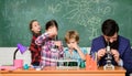 Man bearded teacher and pupils with test tubes in classroom. Observe reaction. Science is always the solution. School Royalty Free Stock Photo