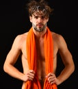 Man bearded tousled hair covered with foam or soap suds. Wash off foam with water carefully. Body care. Man with orange