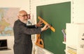 Man bearded tutor in classroom. Teaching is passion. Main task in teaching. Formal education. Classic subjects learning