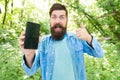 Man bearded wanderer walking in forest with navigation application. Route for exciting adventure. GPS and navigation