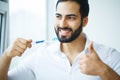 Man With Beautiful Smile, Healthy White Teeth With Toothbrush. H Royalty Free Stock Photo