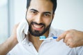 Man With Beautiful Smile, Healthy White Teeth With Toothbrush. H Royalty Free Stock Photo