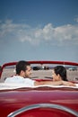 Man and beautiful woman hugging in cabriolet car Royalty Free Stock Photo