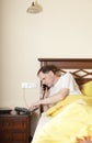 Man in bed calling by phone Royalty Free Stock Photo