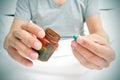 Man in bed about to take a blue pill Royalty Free Stock Photo