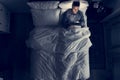 Man on bed using his tablet Royalty Free Stock Photo