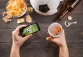 Man with beer watching soccer game on smarphone Royalty Free Stock Photo