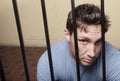 Man behind bars Royalty Free Stock Photo