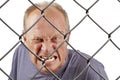 Man behind bars Royalty Free Stock Photo