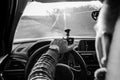 The man behind the wheel of the car looks forward, his hand on the steering wheel Royalty Free Stock Photo
