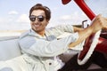 Handsome man behind the wheel of an old school car Royalty Free Stock Photo