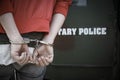 A man being arrested and handcuffed by the military police Royalty Free Stock Photo