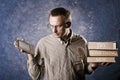 Man being focused on light and handy ebook reader, holding heavy books in other hand, try something new written on books. Royalty Free Stock Photo