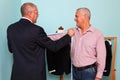 Man being measured for a bespoke suit