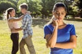 Man being unfaithful in the park Royalty Free Stock Photo