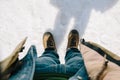 Man bend down the head looking for his boots standing on snow Royalty Free Stock Photo