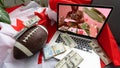 Man betting on sports using laptop at table, closeup. Bookmaker website on screen Royalty Free Stock Photo