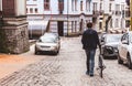 Man with a bicycle goes along the street Royalty Free Stock Photo