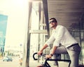 Man with bicycle and headphones on city street Royalty Free Stock Photo