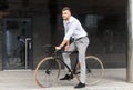 Man with bicycle and headphones on city street Royalty Free Stock Photo