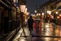 Man on a bicycle in historic Kyoto district at night Royalty Free Stock Photo