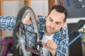 man bicycle mechanic repairing bicycles Royalty Free Stock Photo