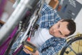 Man bicycle mechanic repairing bicycles Royalty Free Stock Photo