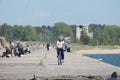 The man with bicycle is on the Northern Breakwater in Liepaja,Latvia