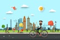 Man on Bicycle on Street with People on City Park Royalty Free Stock Photo