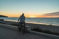 Man on the bicycle watching the sunset. Royalty Free Stock Photo