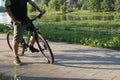 A man on a bicycle. Bicycle wheels close-up. The foot is on the bicycle pedal. Active summer Royalty Free Stock Photo