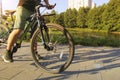 A man on a bicycle. Bicycle wheels close-up. The foot is on the bicycle pedal. Active summer Royalty Free Stock Photo