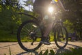 A man on a bicycle. Bicycle wheels close-up. The foot is on the bicycle pedal. Active summer Royalty Free Stock Photo