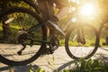 A man on a bicycle. Bicycle wheels close-up. The foot is on the bicycle pedal. Active summer Royalty Free Stock Photo