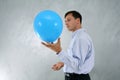 Man with big blue baloon