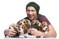 The man and big group of a beagle puppies Royalty Free Stock Photo