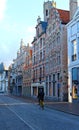 Man on bike in Brugges on a chilly autumn morning