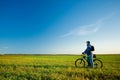 Man on bike in field