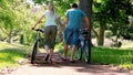 Man with a bike while limping