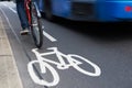 Man On Bike Using Cycle Lane As Traffic Speeds Past Royalty Free Stock Photo