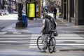 man biking in the empty streets in the downtown Chicago area