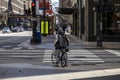 man biking in the empty streets in the downtown Chicago area