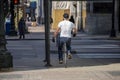 man biking in the empty streets in the downtown Chicago area