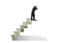 Man w binoculars on money stairs seeking financial success