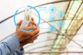 Man biologist pouring liquid from test tube in greenhouse. Royalty Free Stock Photo