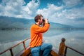 Man birdwatching on a boat Royalty Free Stock Photo