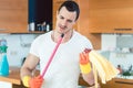 Man is a bit overwhelmed by the duties of a homemaker