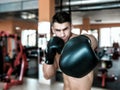 Man with black boxing gloves