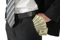 Man in black business suit, holding cash in hands